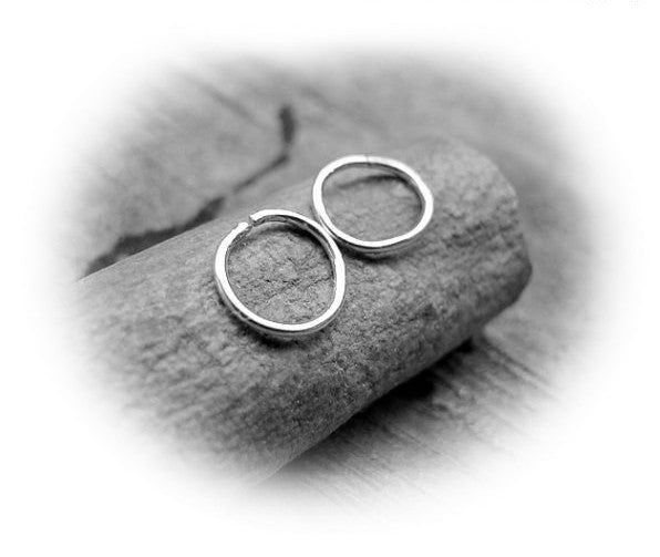 Small catchless silver hoop earrings
