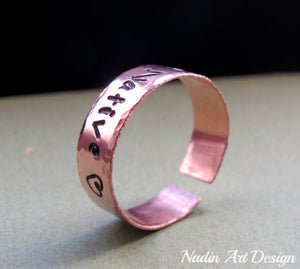 Hammered copper band ring with engraving