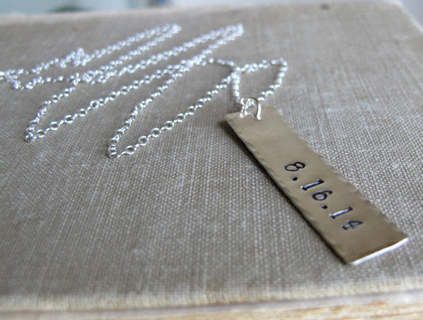 Date tag pendant necklace