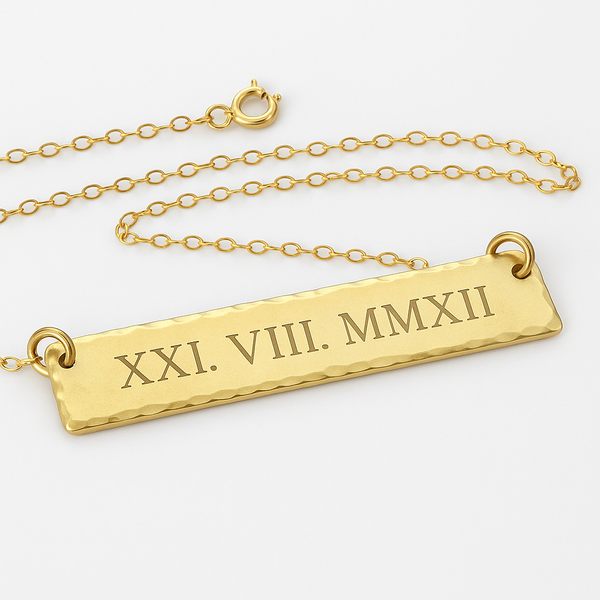Gold necklace with horizontal bar pendant with Roman numerals  