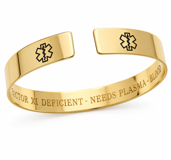 Goldcccuff bracelet featuring an engraved black Star of Life on each end and the text 'FACTOR XI DEFICIENT - NEEDS PLASMA - BLOOD' on the inside, shown on a white background.