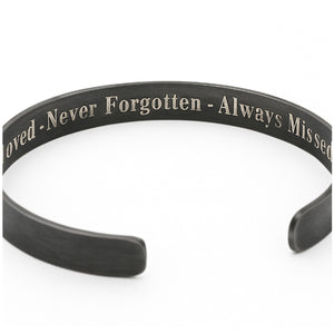 Black bracelet with engraved text on inside