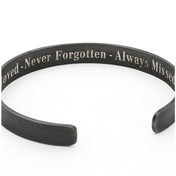 Black bracelet with engraved text on inside