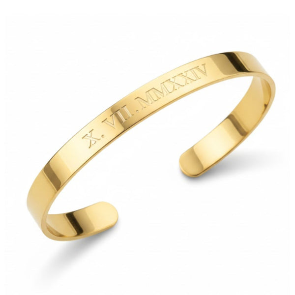 gold cuff bracelet with the roman numeral date