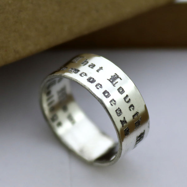 Silver ring with engraved text in Old English font
