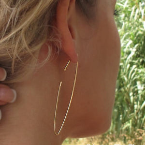 Long gold hoop earrings