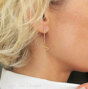 Long stick earrings in gold