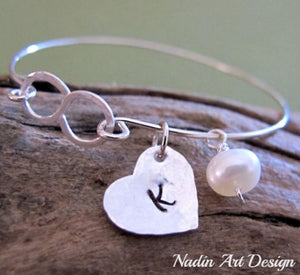 Heart and pearl charm bracelet with infinity symbol
