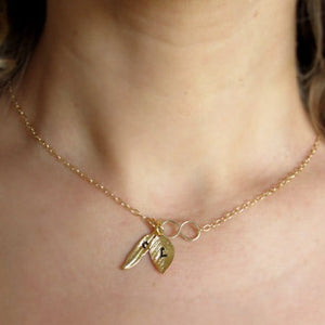 Leaf and feather charms gold necklace