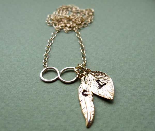 Leaf and feather charms gold necklace