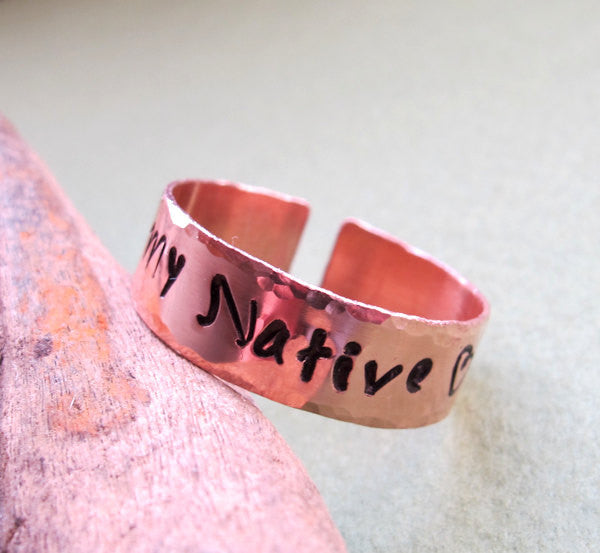 Hammered copper band ring with engraving