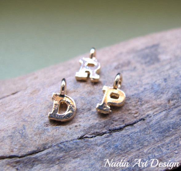 Gold letter charm