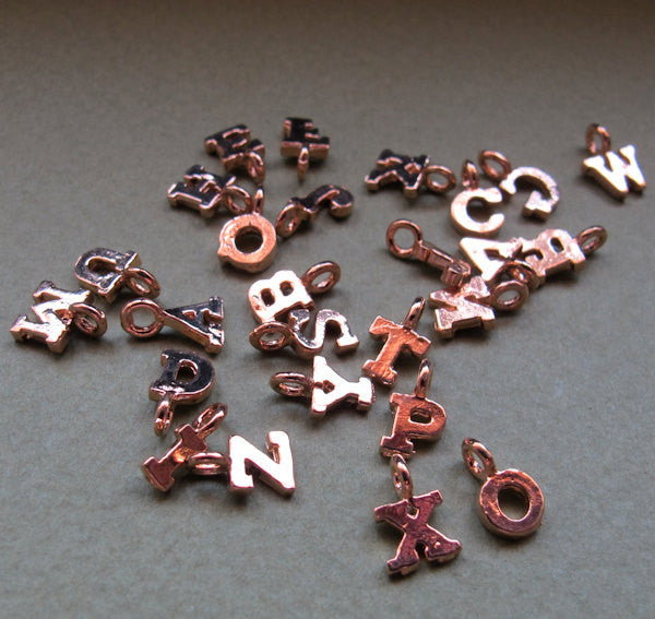 Gold letter charm