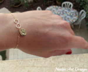 Gold charm infinity bracelet