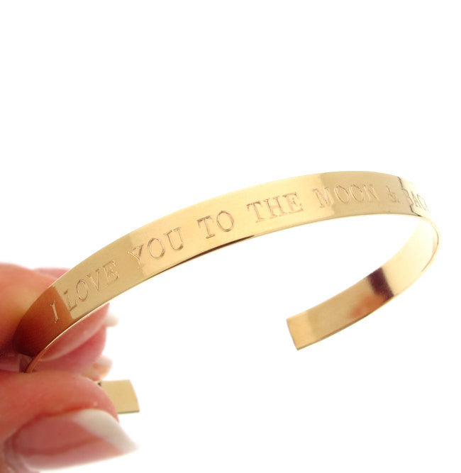 Gold bangle bracelet with engraving