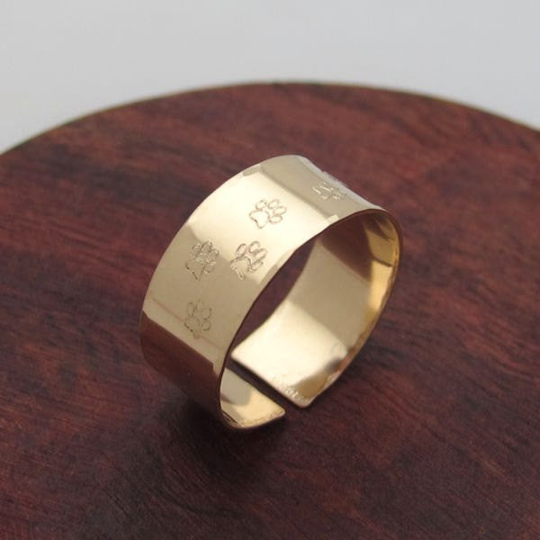 Gold band ring with dog paws