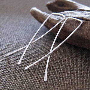 Ling bow crossover earrings in silver